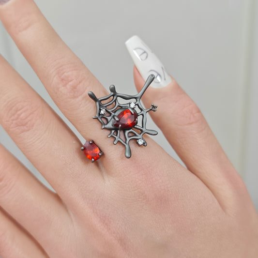 Spider Web Ring on black mannequin hand, front view close-up