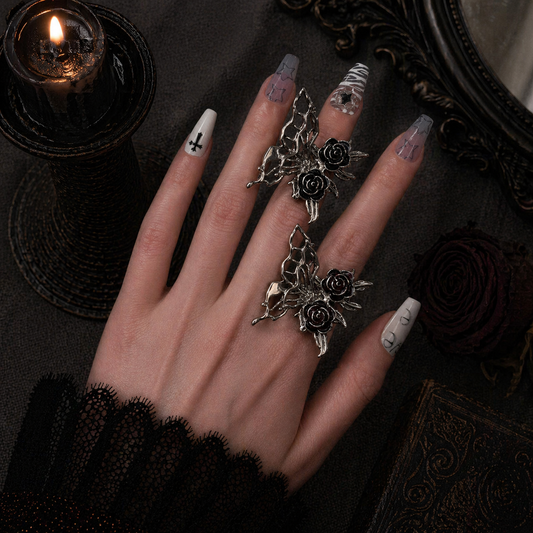 Butterfly Rose Ring worn on finger, dark moody background – Aslop Treasure