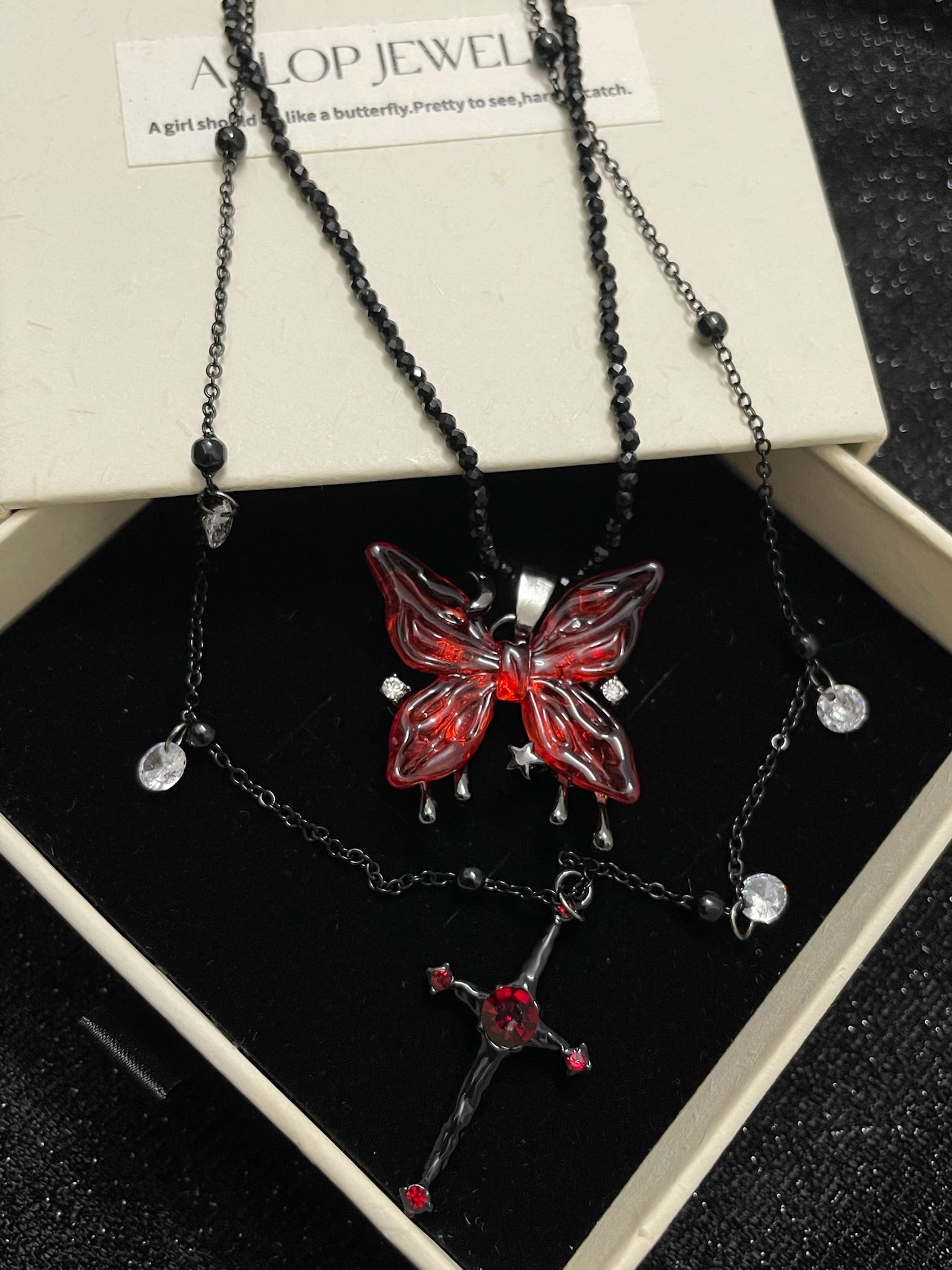 Blood Rose Butterfly & Gothic Cross Necklace close-up detail view showing dark finish