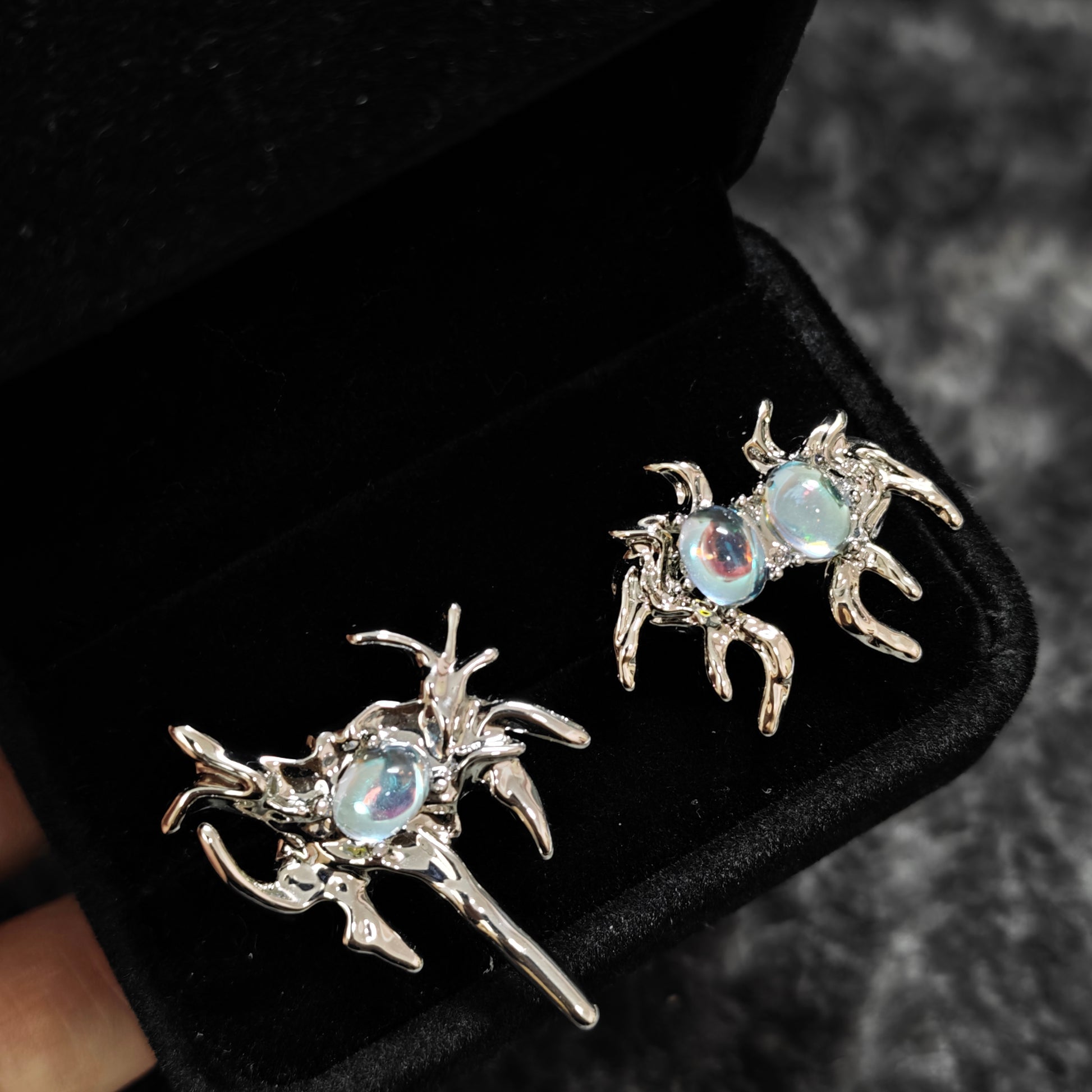 Monster Ring in open black velvet jewelry box, overhead flat lay