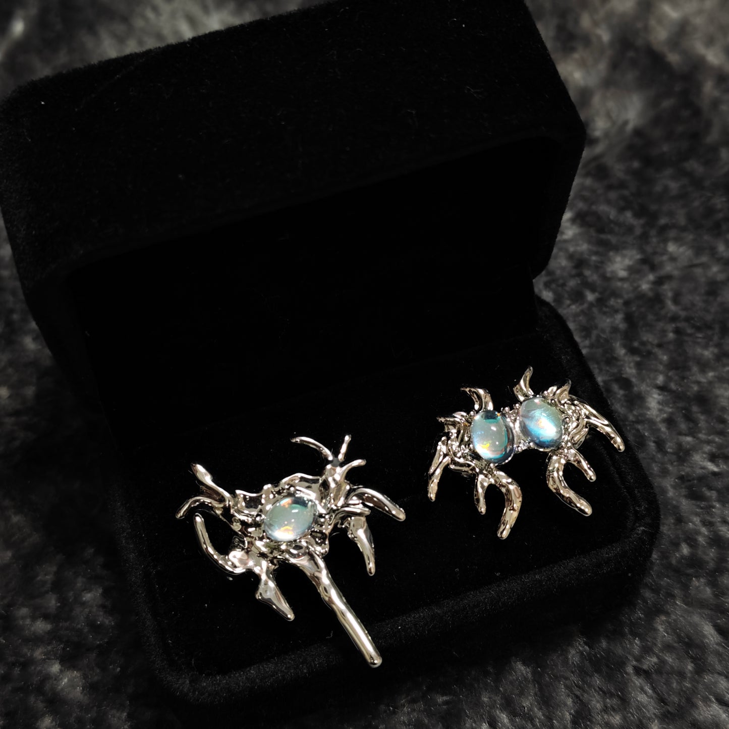 Monster Ring in open black velvet jewelry box, angled view