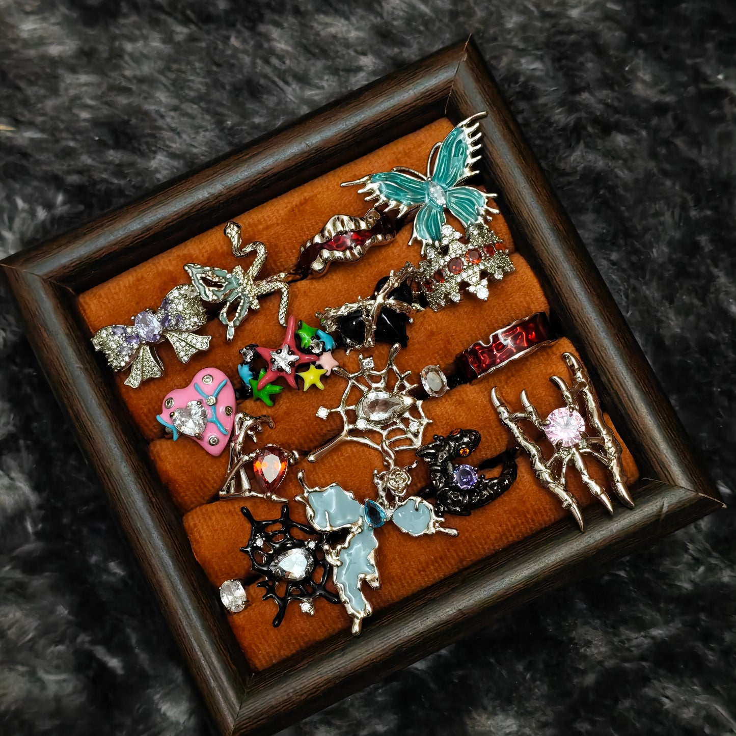 Standalone gothic statement ring on grey velvet tray