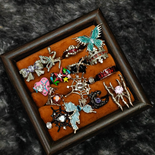 Standalone gothic statement ring on grey velvet tray