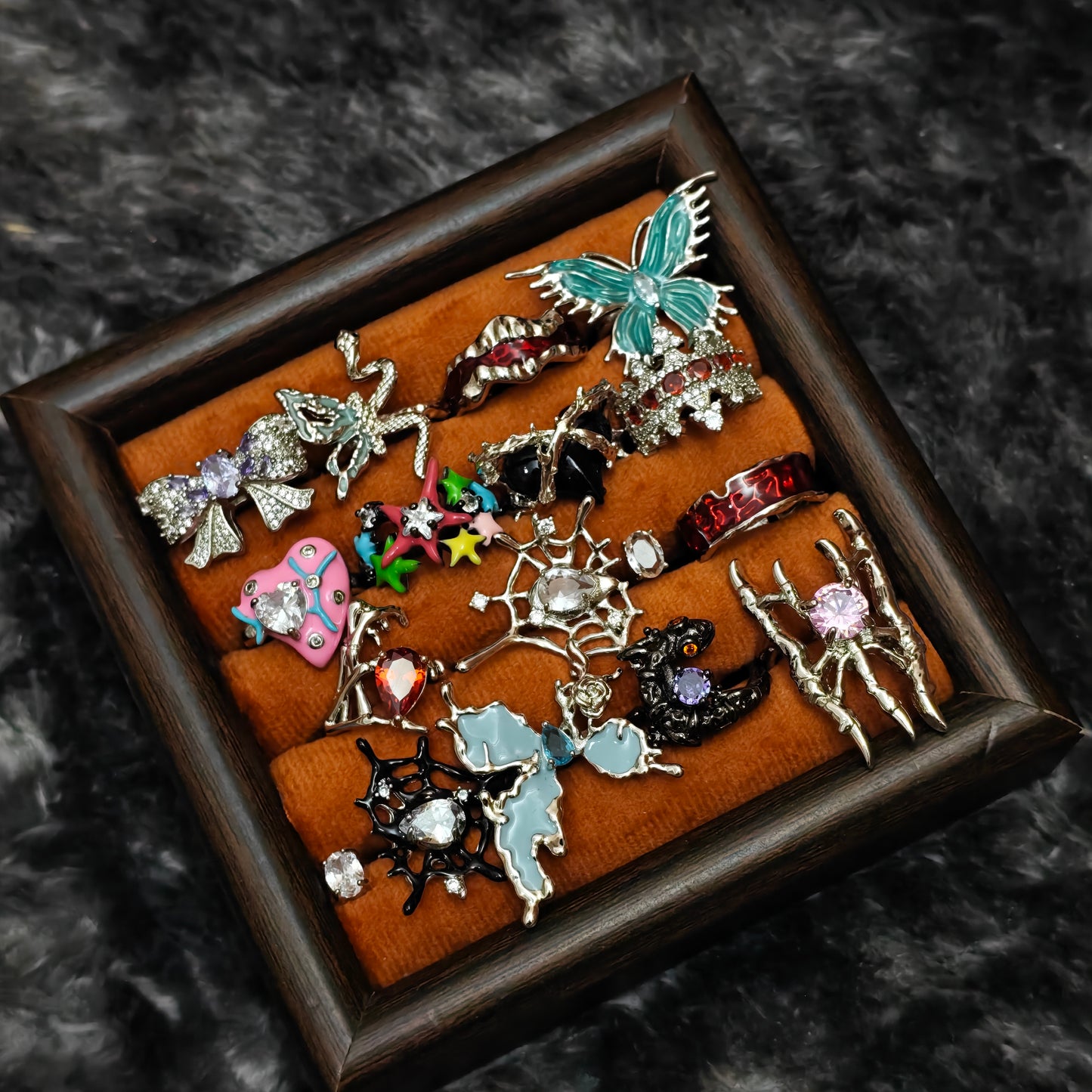 Standalone gothic statement rings on grey velvet tray