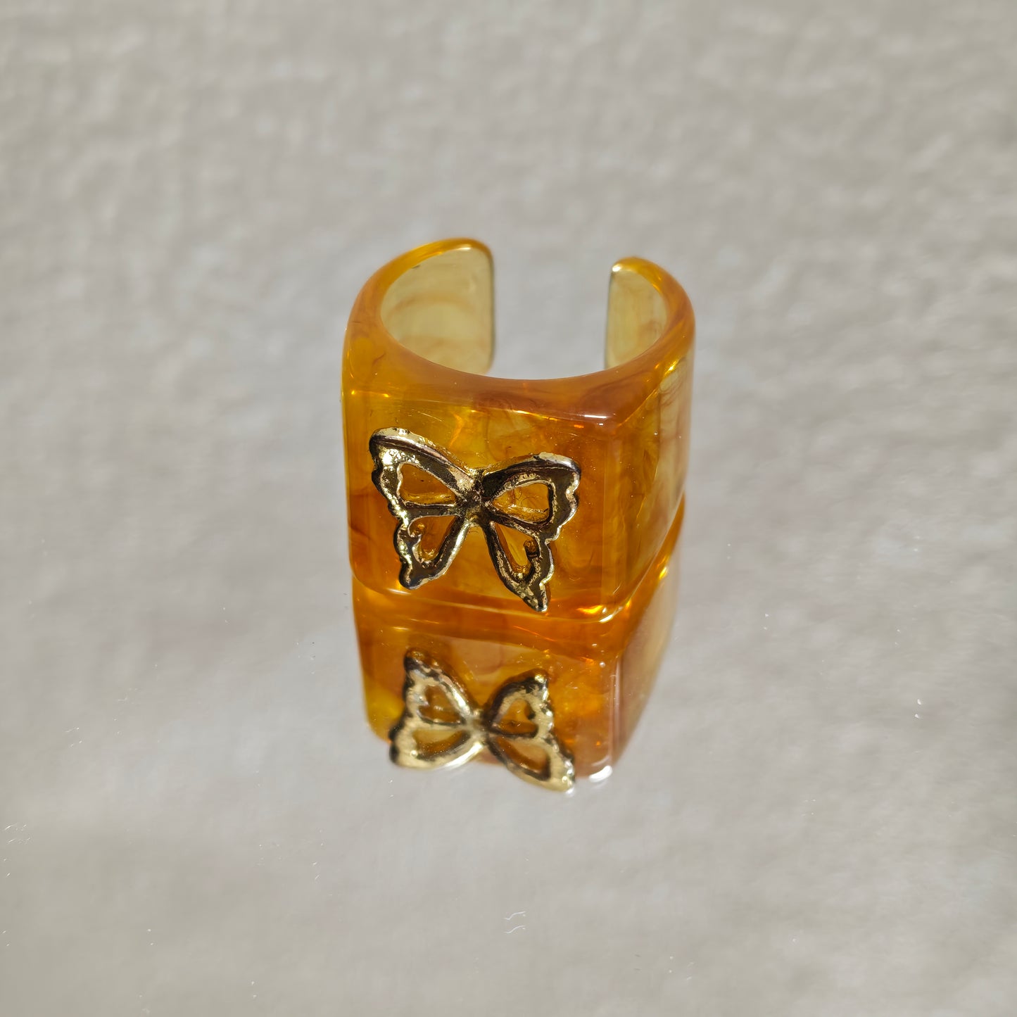 amber resin ring gold butterfly detail