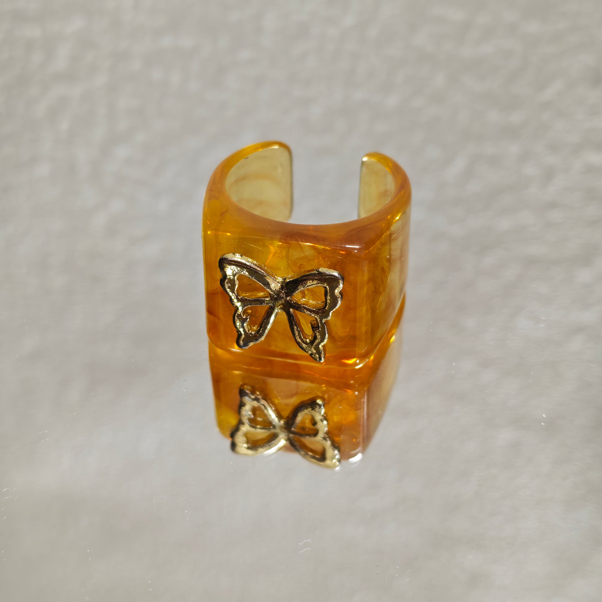 amber resin ring gold butterfly detail