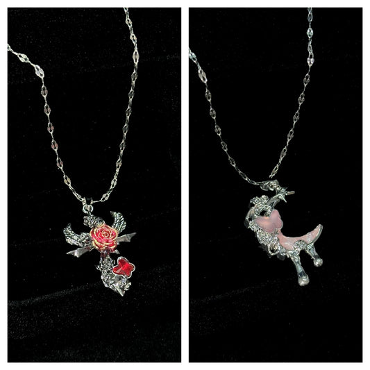 Two delicate silver-tone chain necklaces with angel wing rose butterfly pendant and pink crescent moon pendant