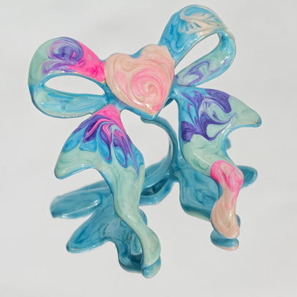 Blue purple pink marble enamel bow ring close up