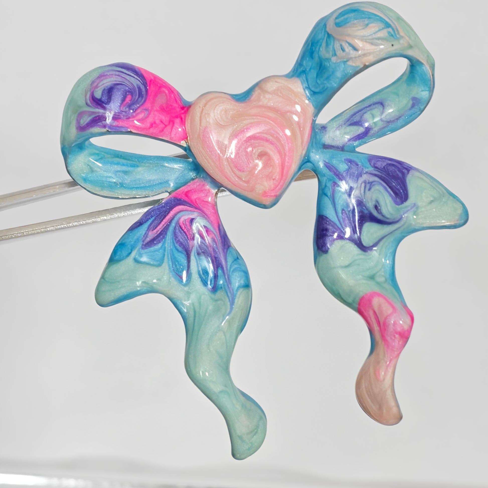 Copper enamel bow ring heart detail top view