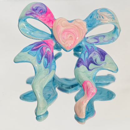 Pastel marbled enamel bow ring with pink heart centre