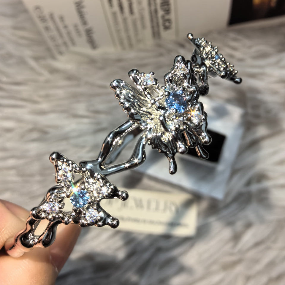 dark silver gothic butterfly bracelet with blue zirconia closeup