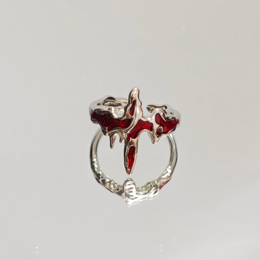 Adjustable silver flaming cross ring with red enamel on hand