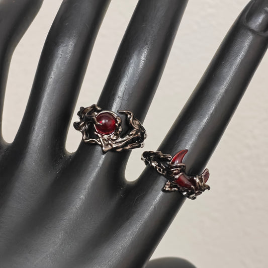 Adjustable gunmetal gothic rings close up