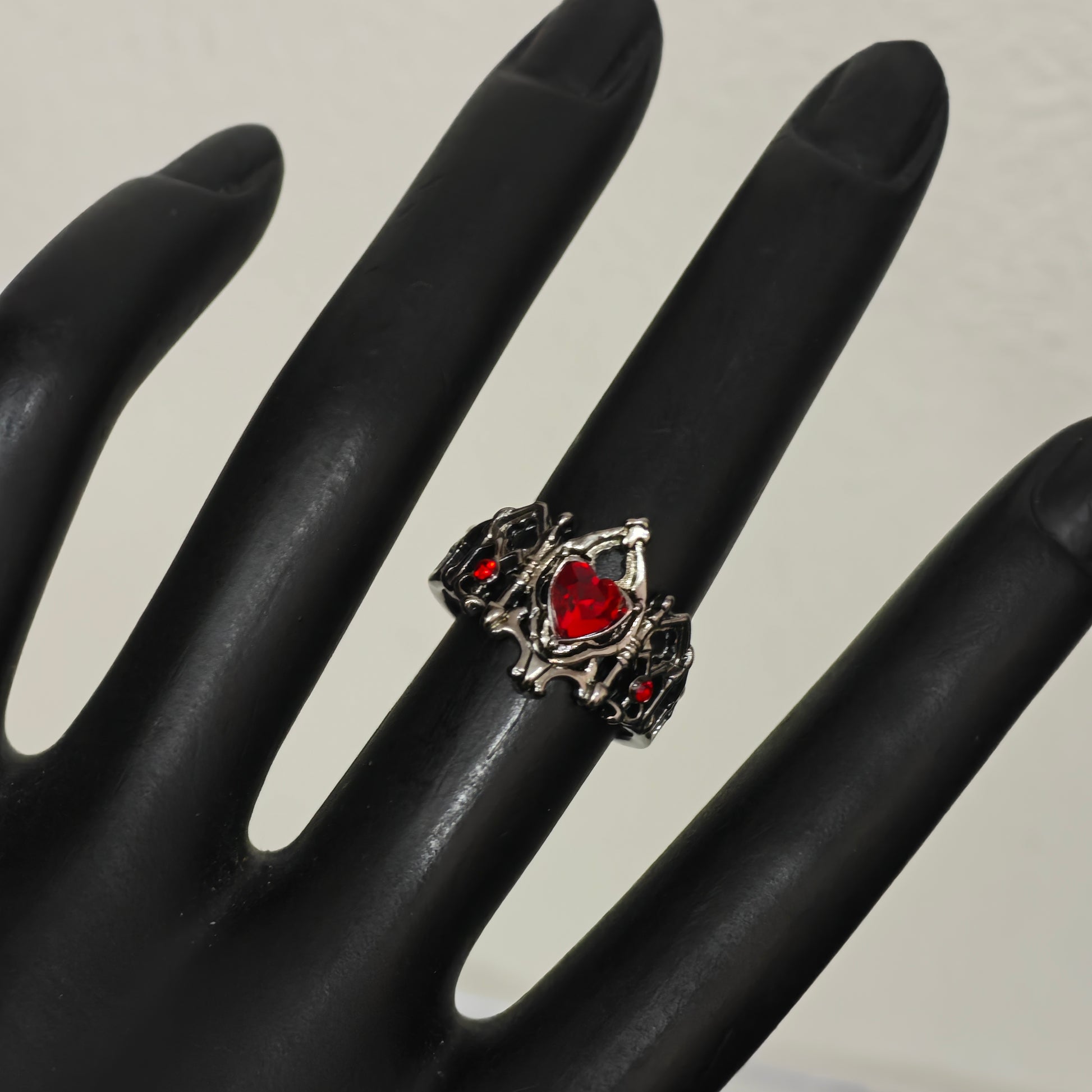 Gunmetal gothic filigree crown ring on hand