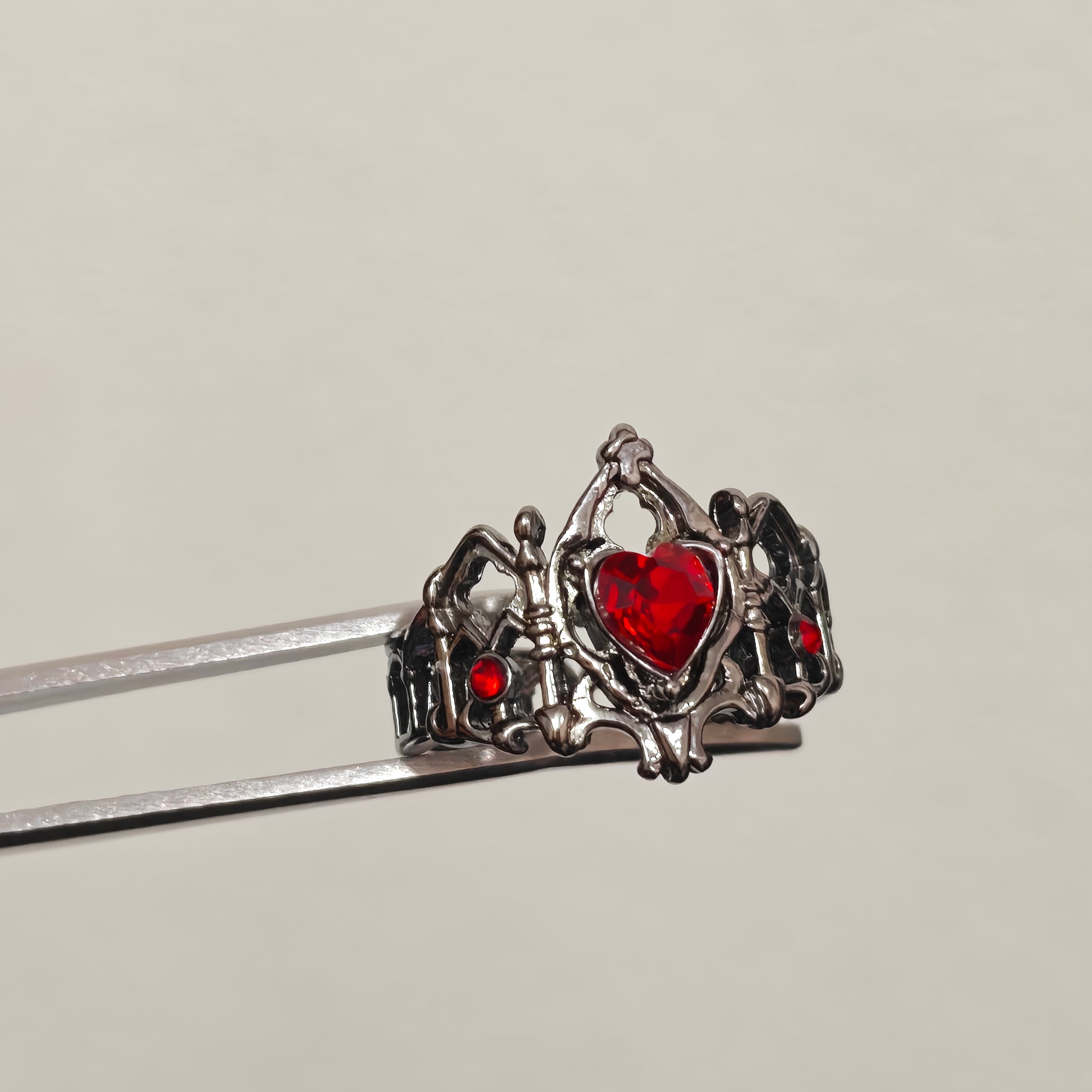 Gothic adjustable ring with red heart and crown detail