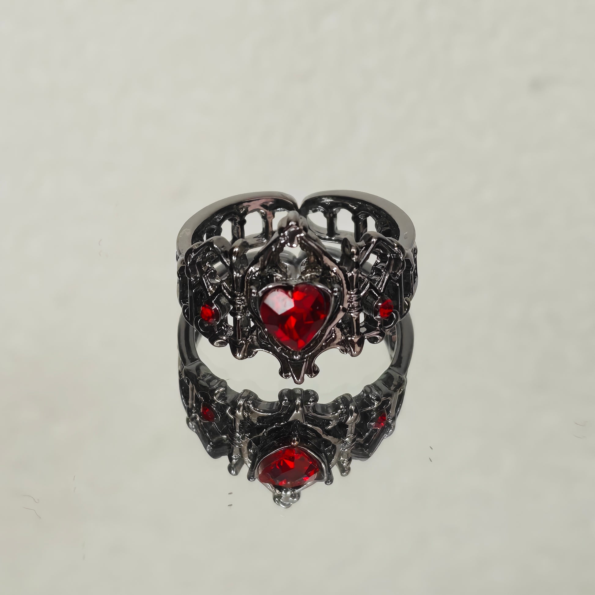 Gothic adjustable ring with red heart and crown detail