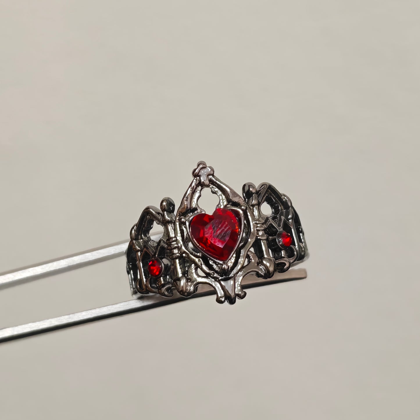 Gothic crown statement ring with red accent stones