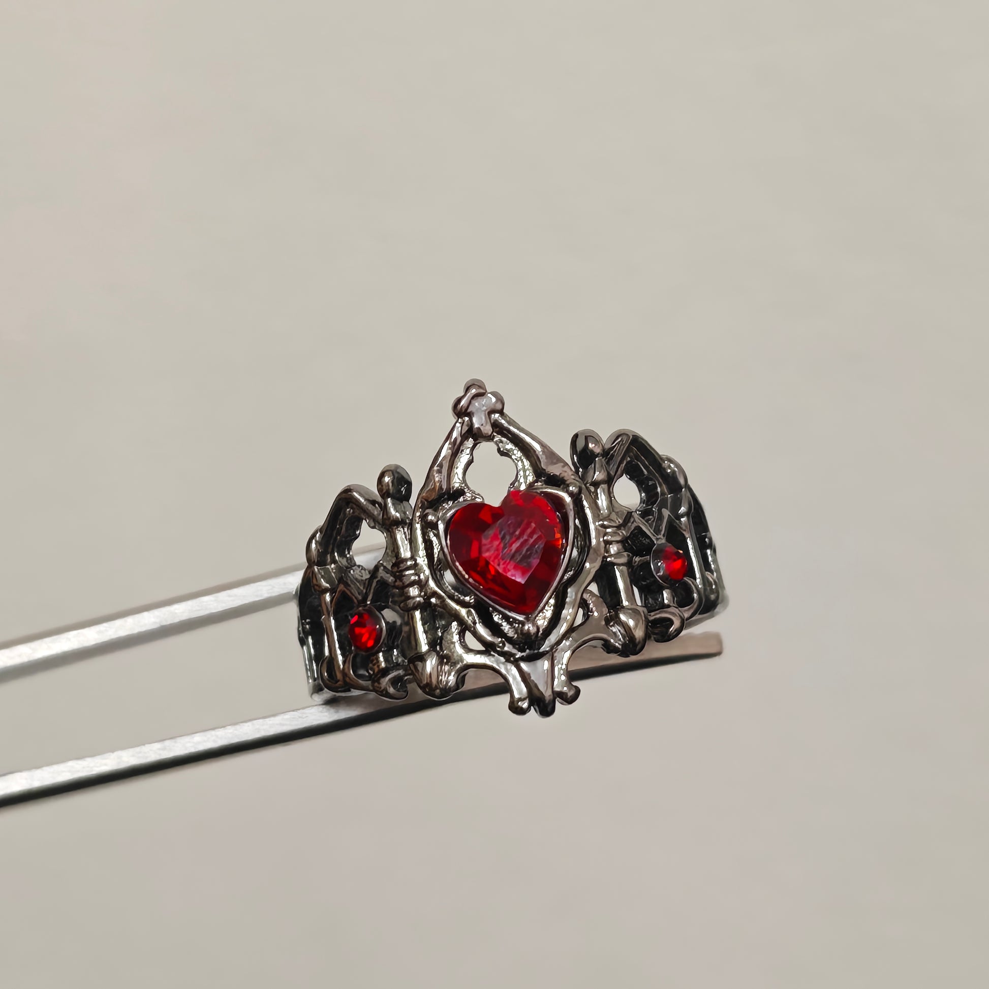 Gothic crown statement ring with red accent stones