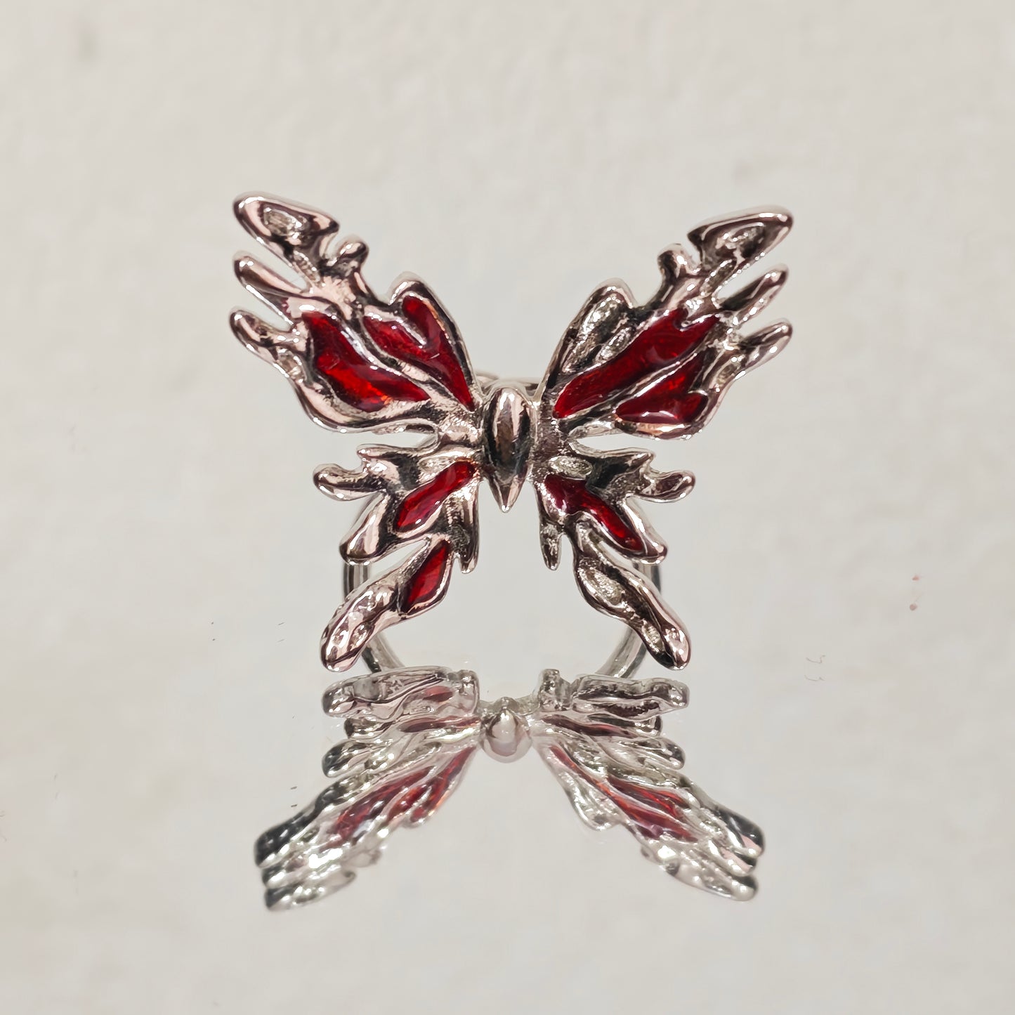Red enamel butterfly ring close up detail