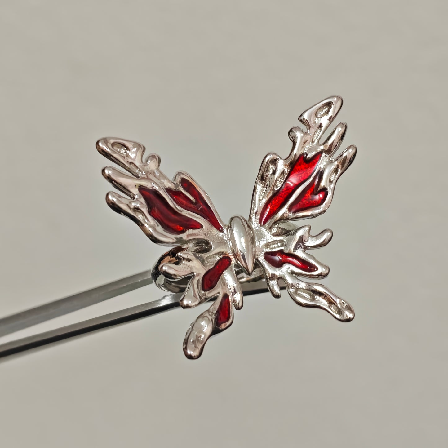 Silver butterfly statement ring with red enamel wings