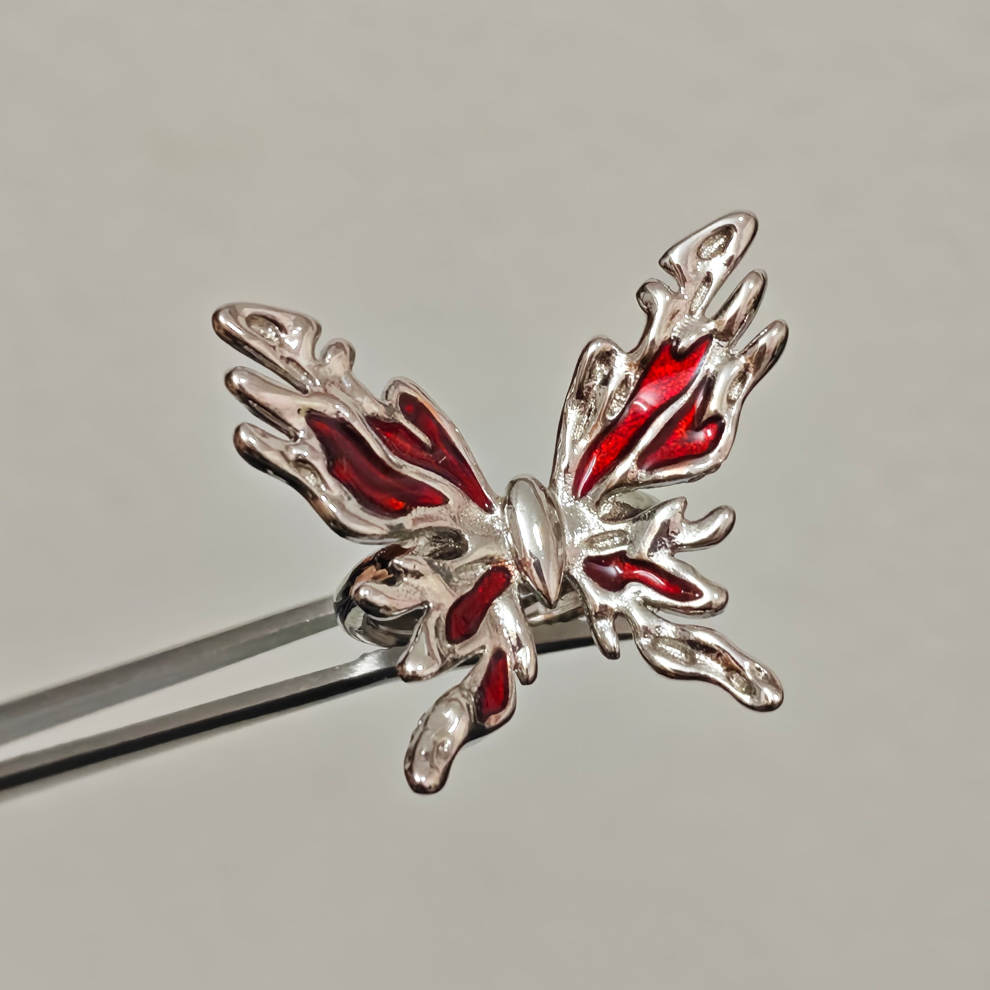 Silver butterfly statement ring with red enamel wings