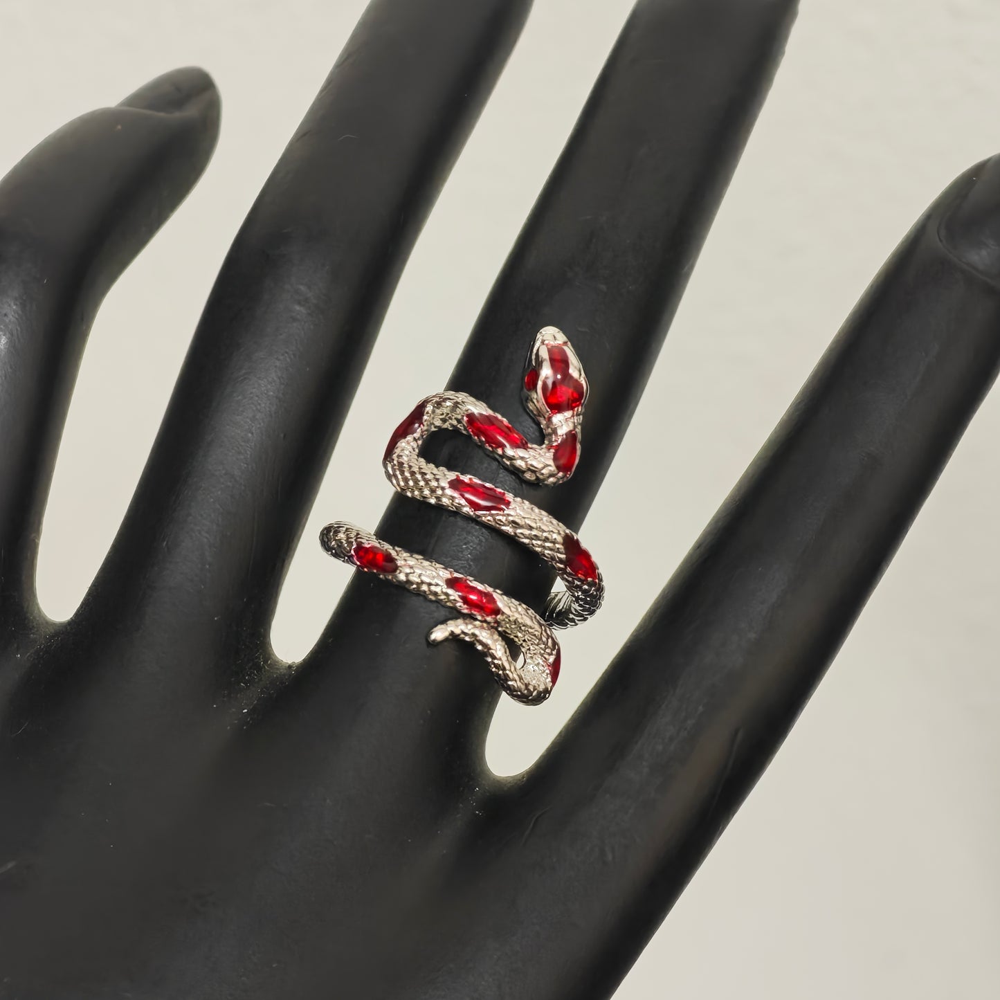 Gothic red enamel snake ring close up detail