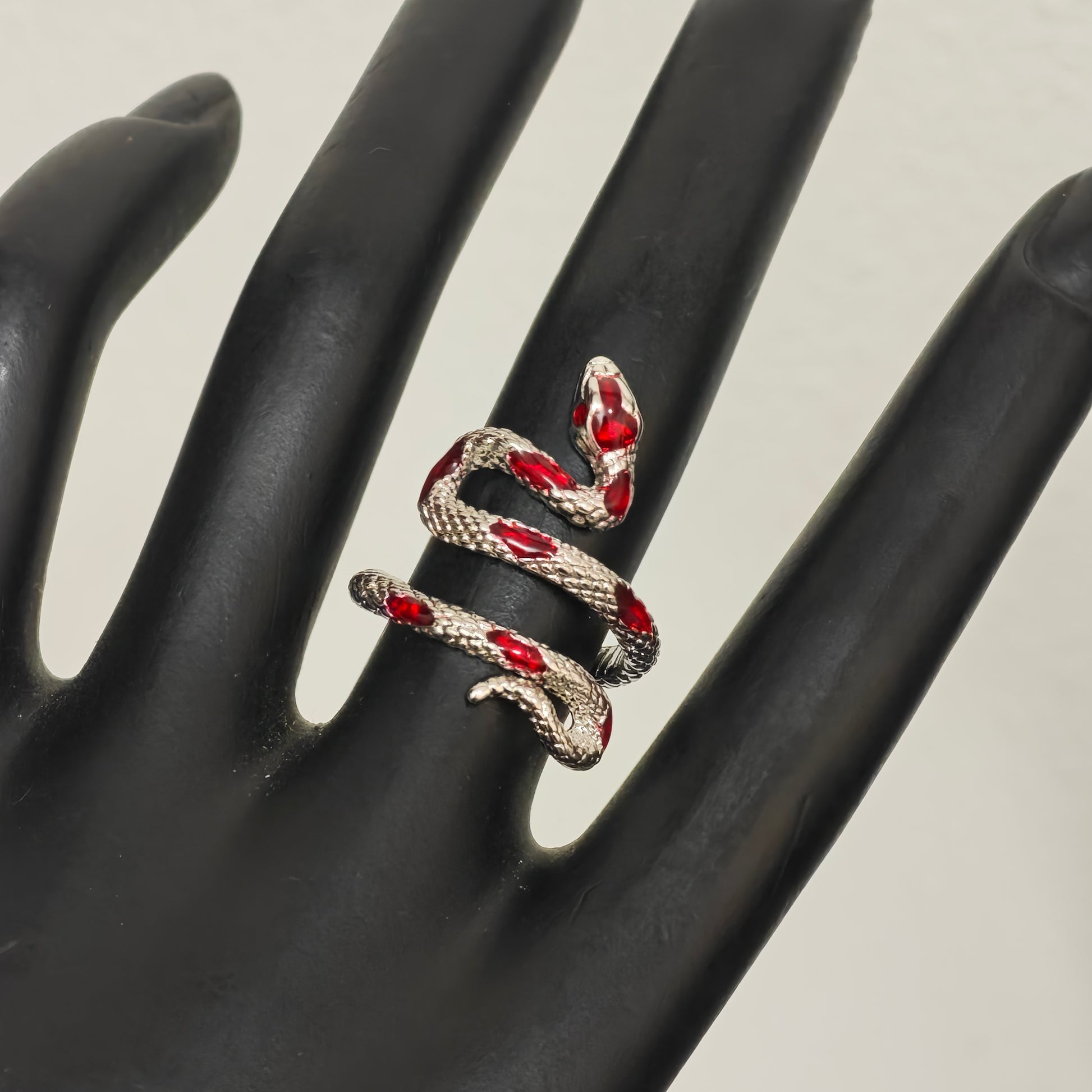 Gothic red enamel snake ring close up detail