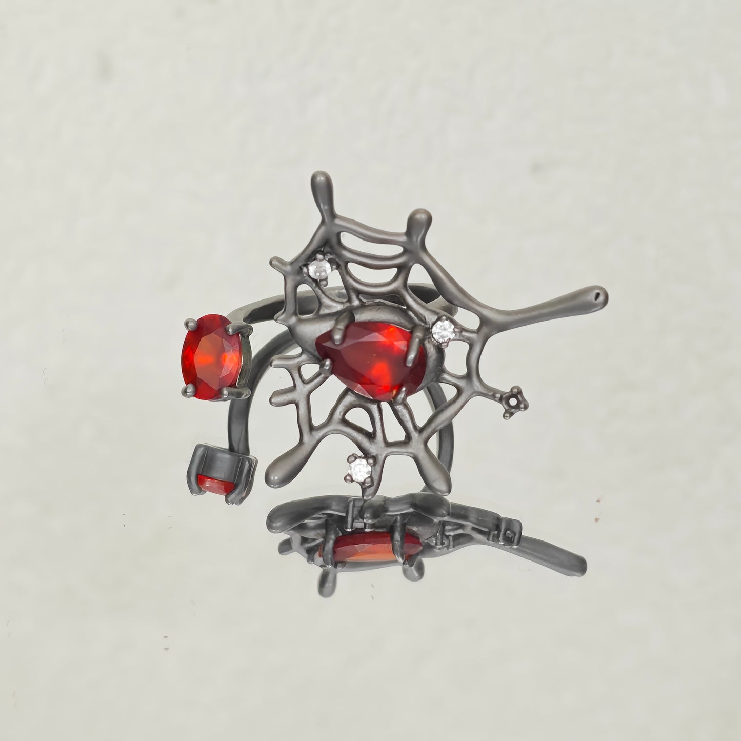 Spider web statement ring gunmetal and red