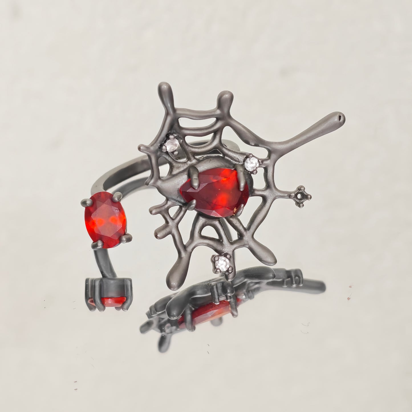 Gothic ring with red teardrop and zircon detail