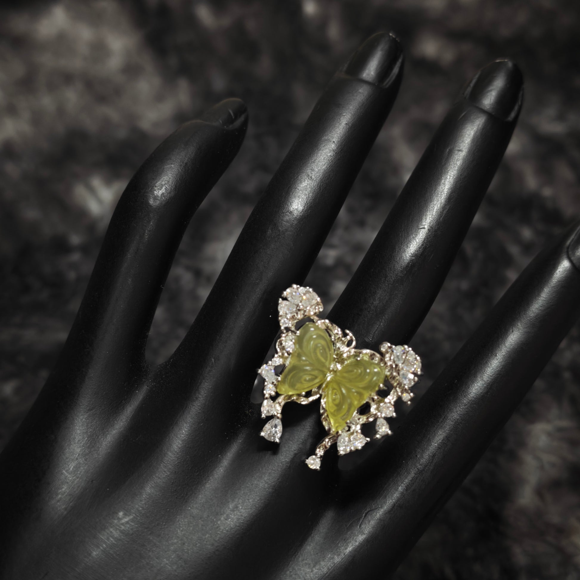 Green carved butterfly ring teardrop zircon close up