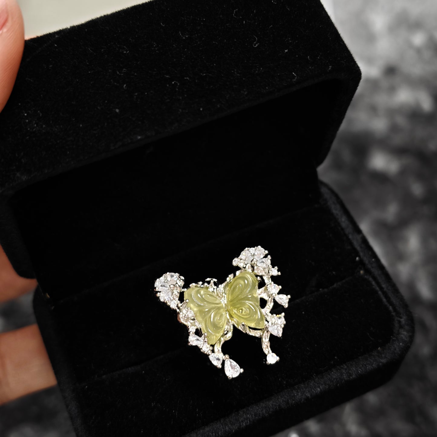 Carved butterfly ring with cascading zircon detail