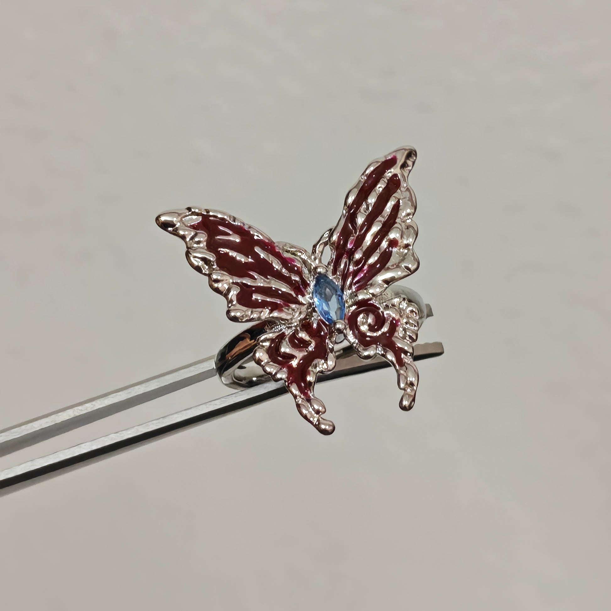Dark aesthetic butterfly ring red and blue detail
