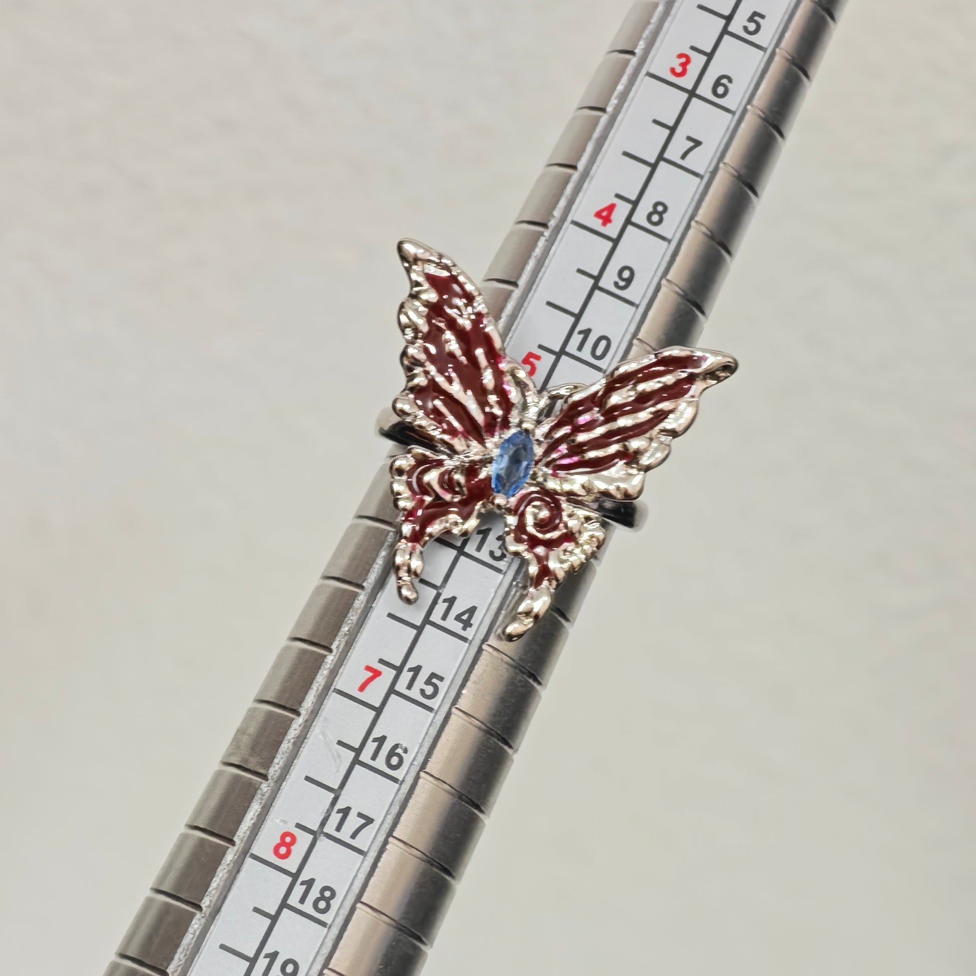 Adjustable butterfly ring red enamel wings top view
