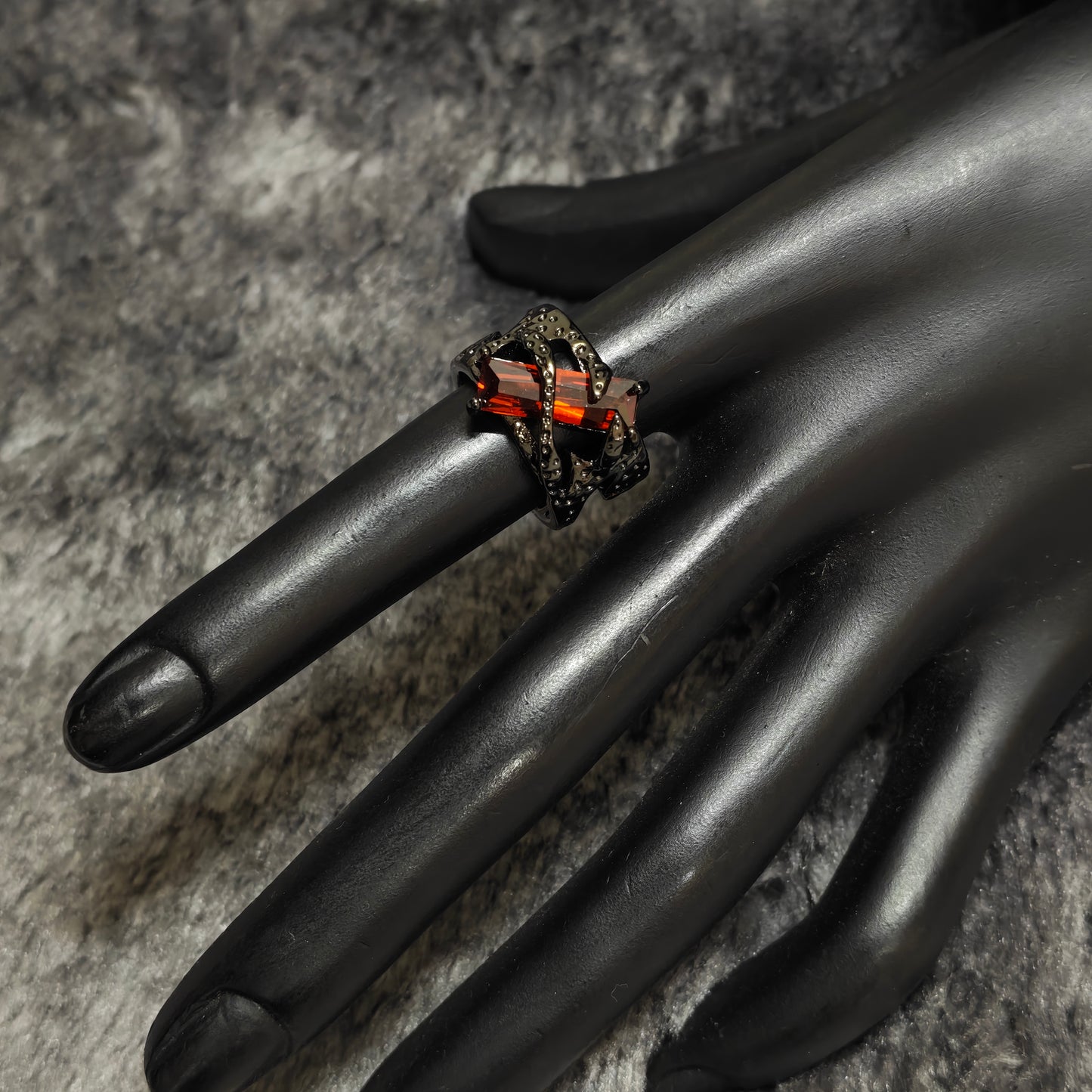red gemstone ring punk alternative style