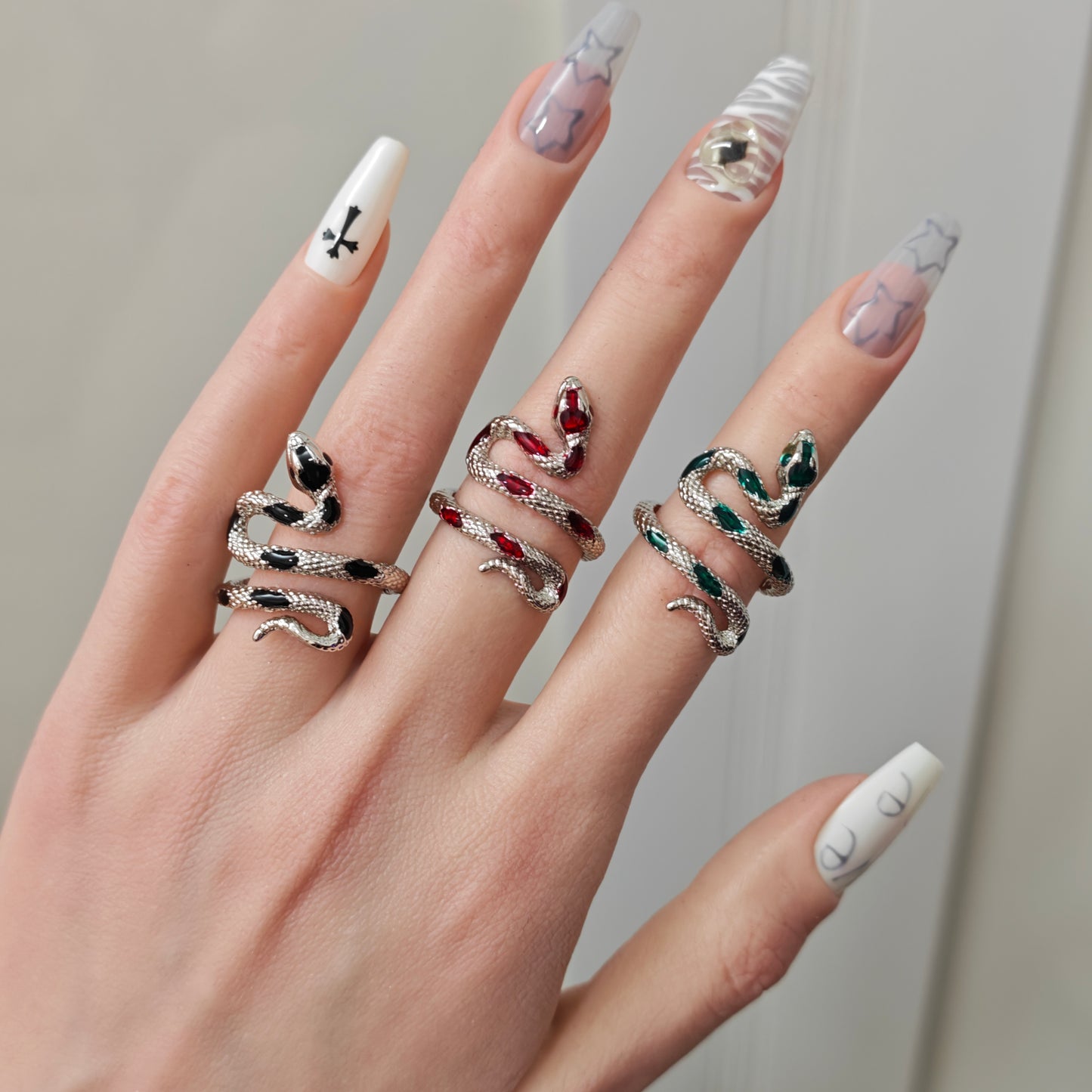 Coiled Snake Ring in open Aslop Jewelry white gift box, angled view