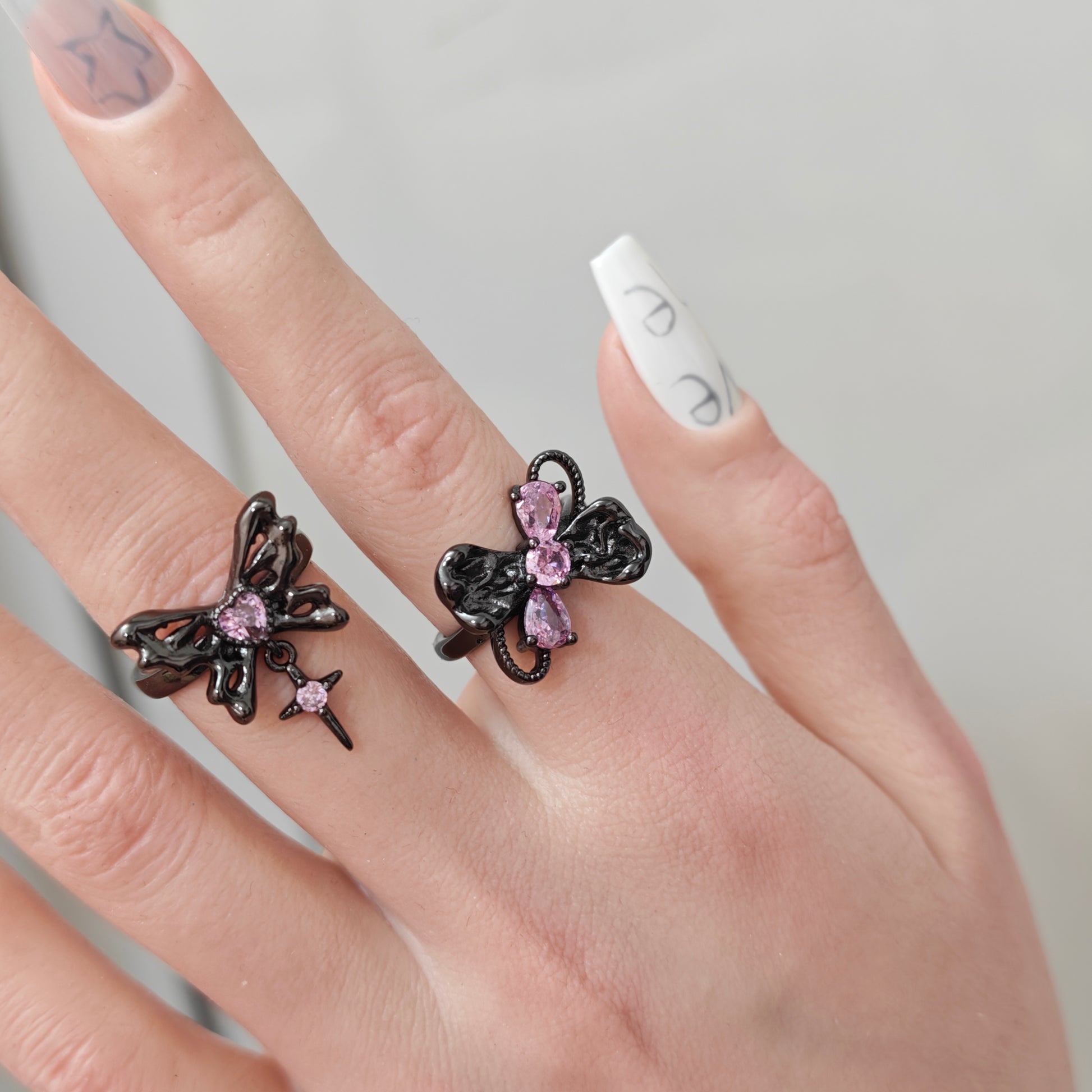 Pink Flutter Duo Adjustable Butterfly Heart & Crystal Stacking Rings in open Aslop Jewelry white gift box, angled view