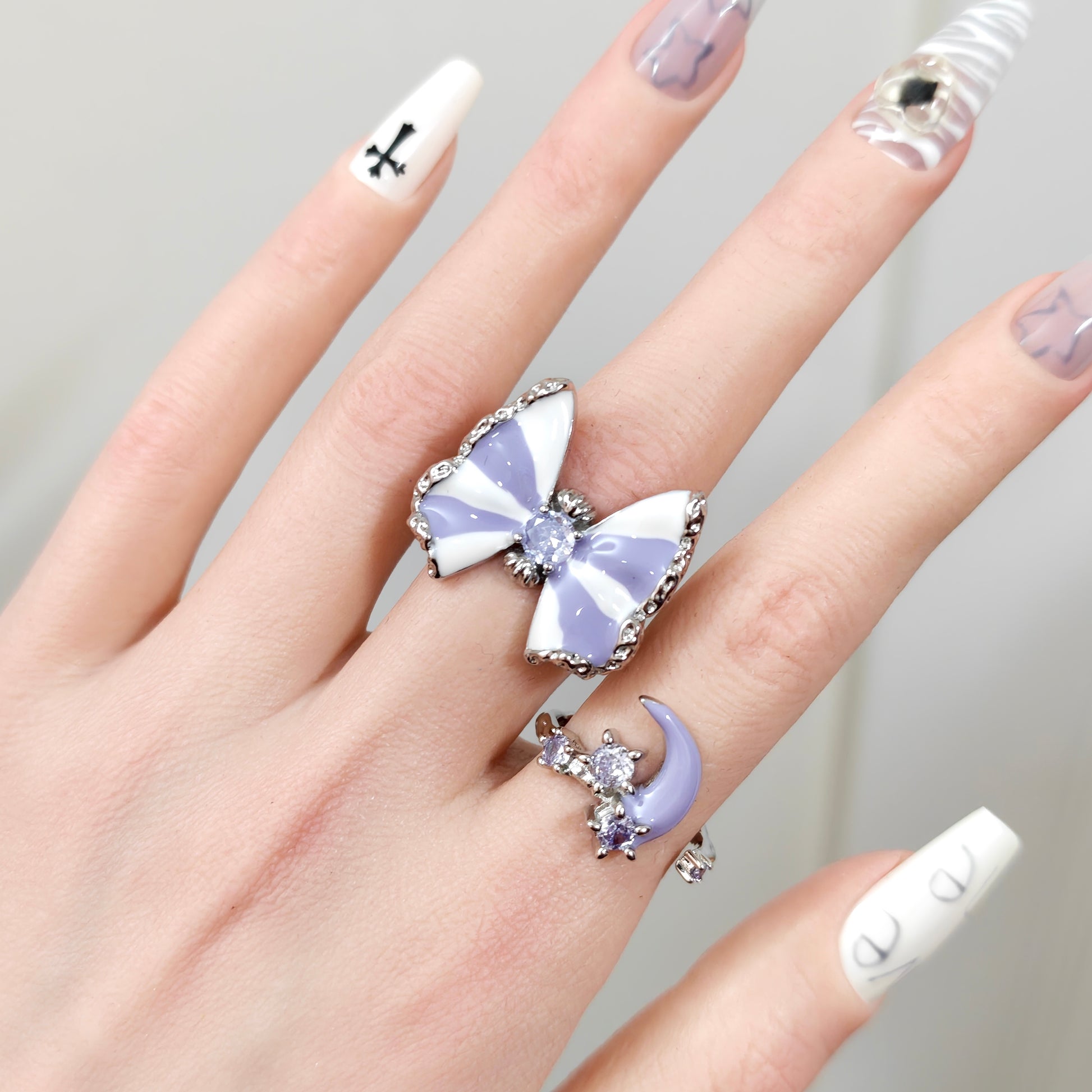 Butterfly & Moon Ring Set in open black velvet jewelry box, overhead flat lay