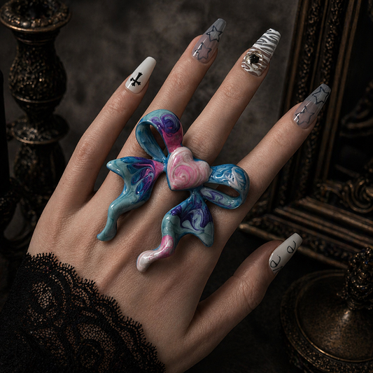 Bow Heart Enamel Ring worn on finger, dark moody background – Aslop Treasure