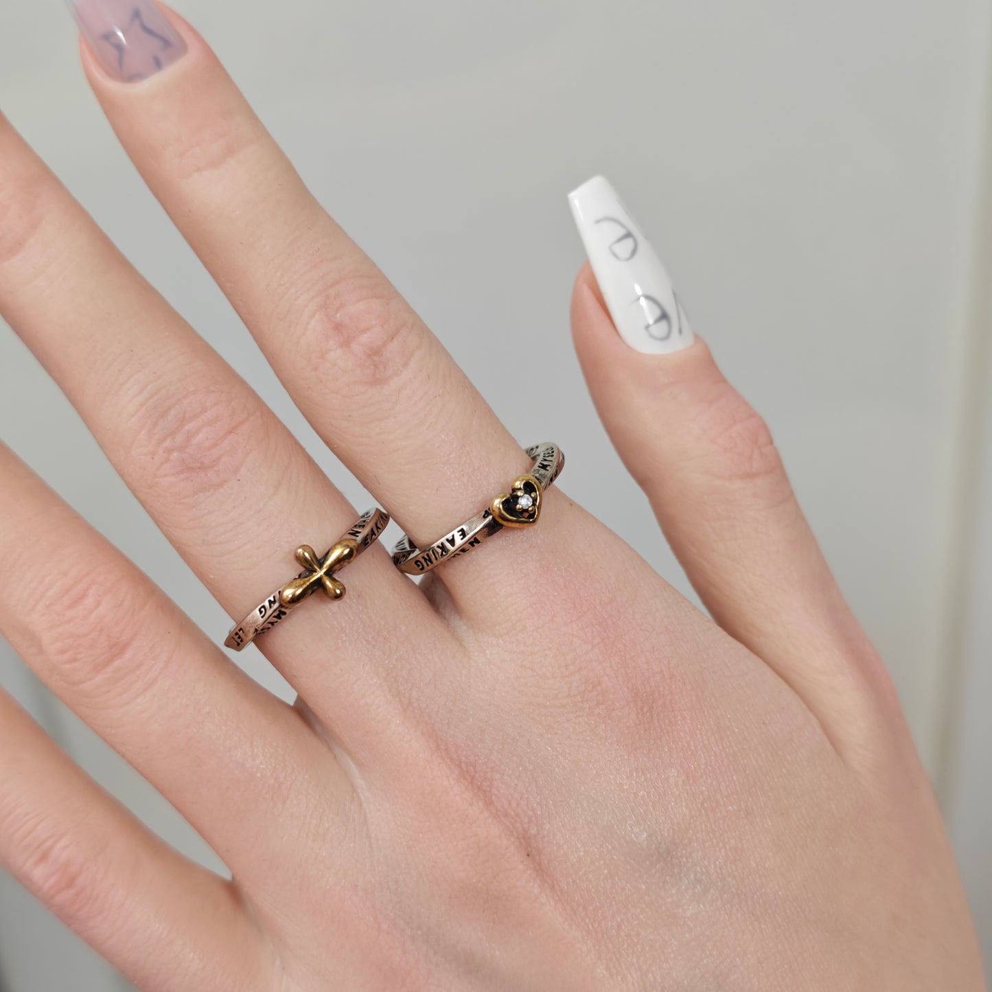 Engraved Letter Double Band Ring in open black velvet jewelry box, overhead flat lay