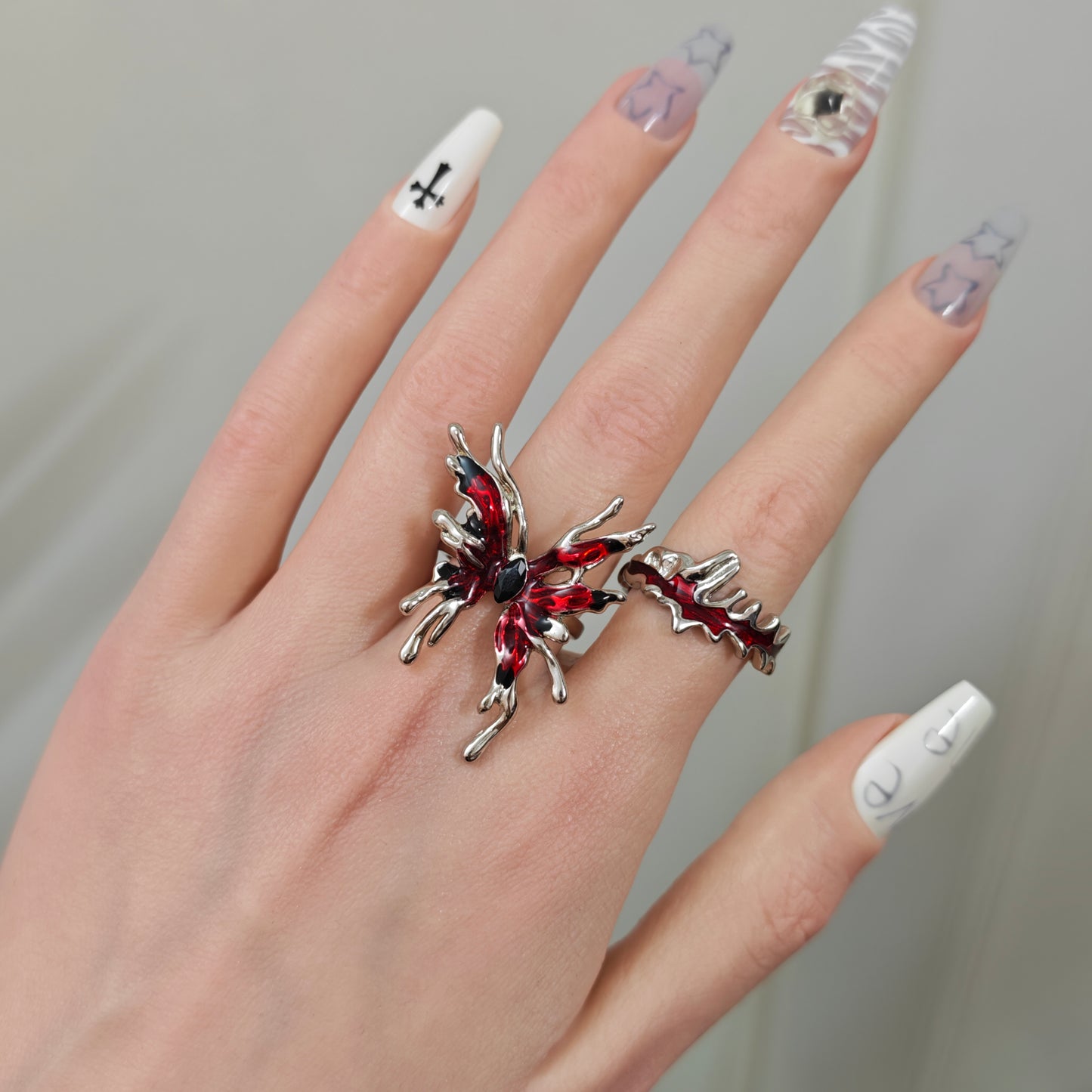 Red Butterfly Ring Set in open black velvet jewelry box, angled view
