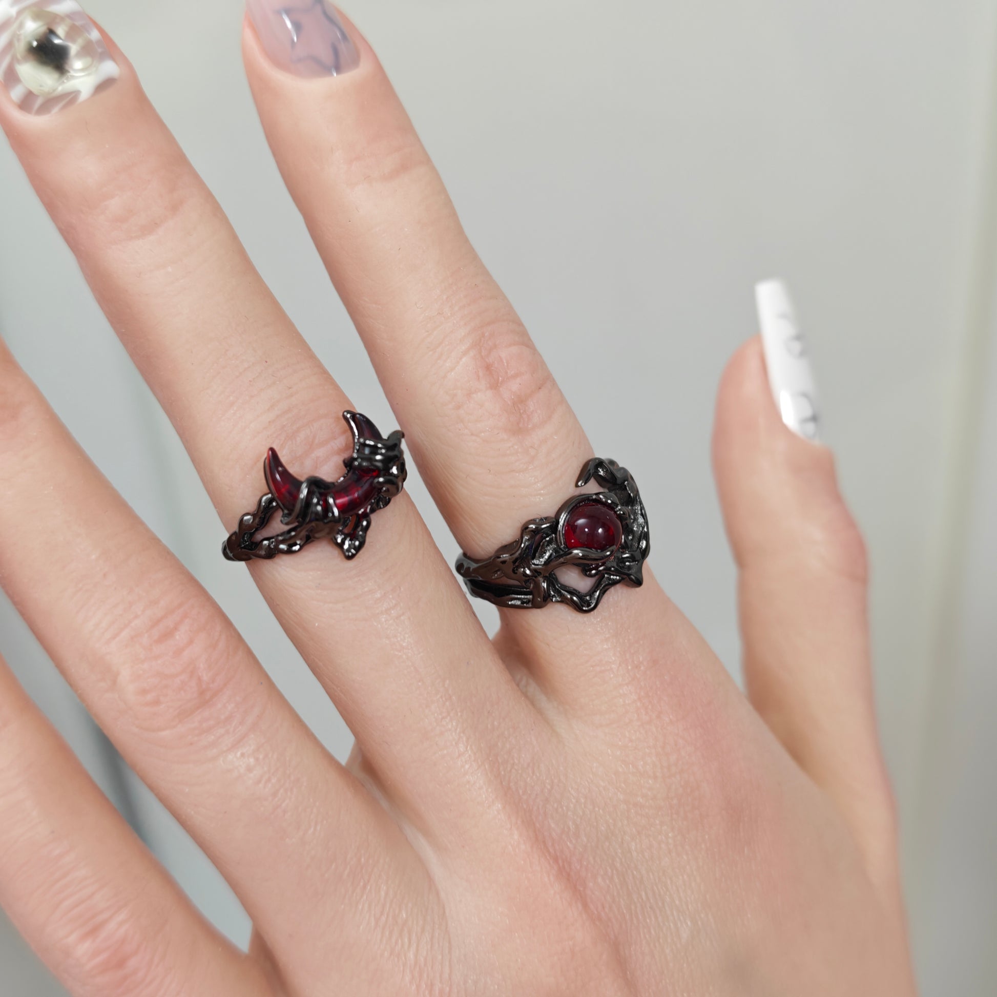 Gothic Dark Ring Set in open black velvet jewelry box, overhead flat lay