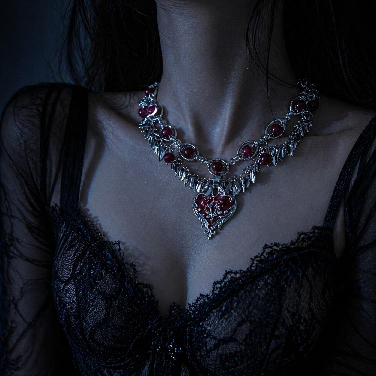 Dark Romance Rose Heart Necklace in open black velvet jewelry box, overhead flat lay