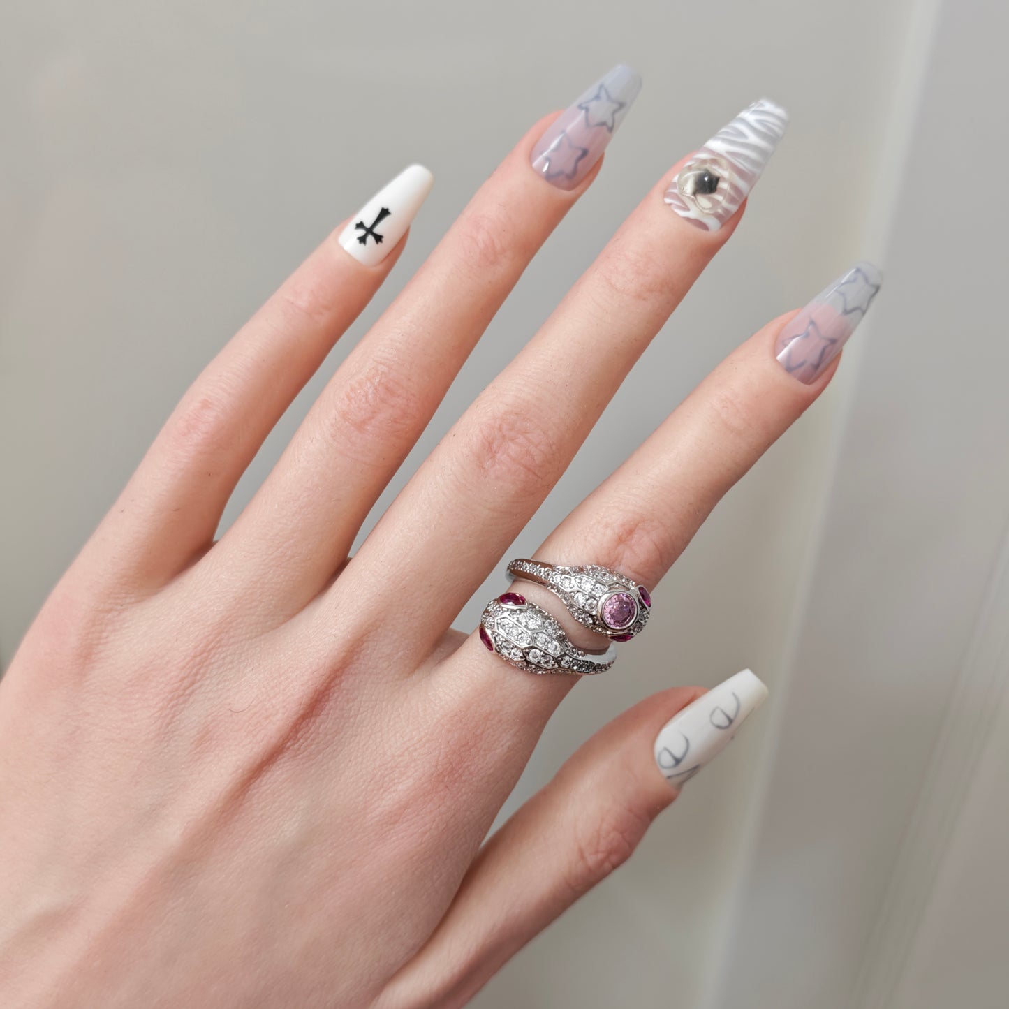Pink Snake Ring in open Aslop Jewelry white gift box, angled view