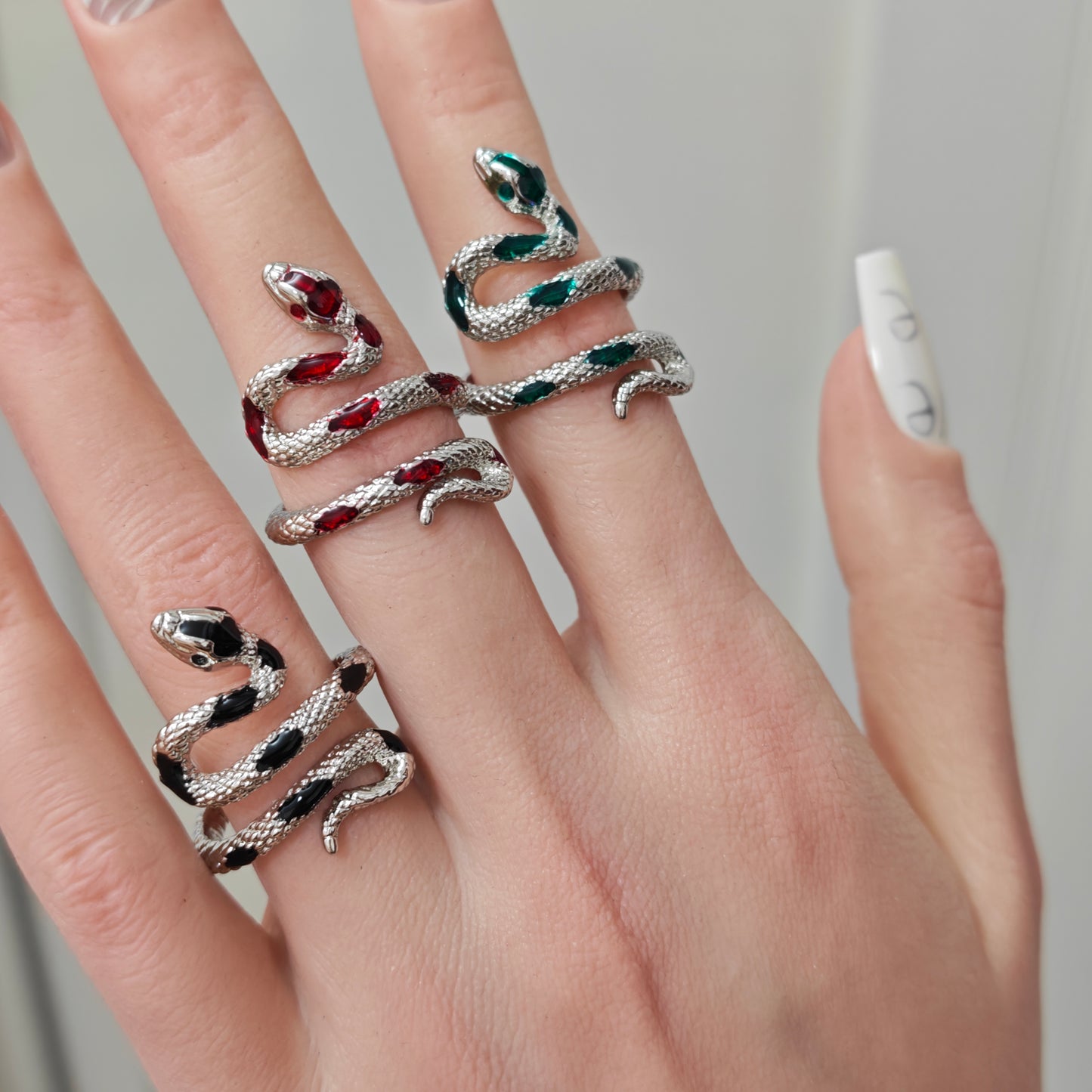 Coiled Snake Ring in open Aslop Jewelry white gift box, overhead flat view