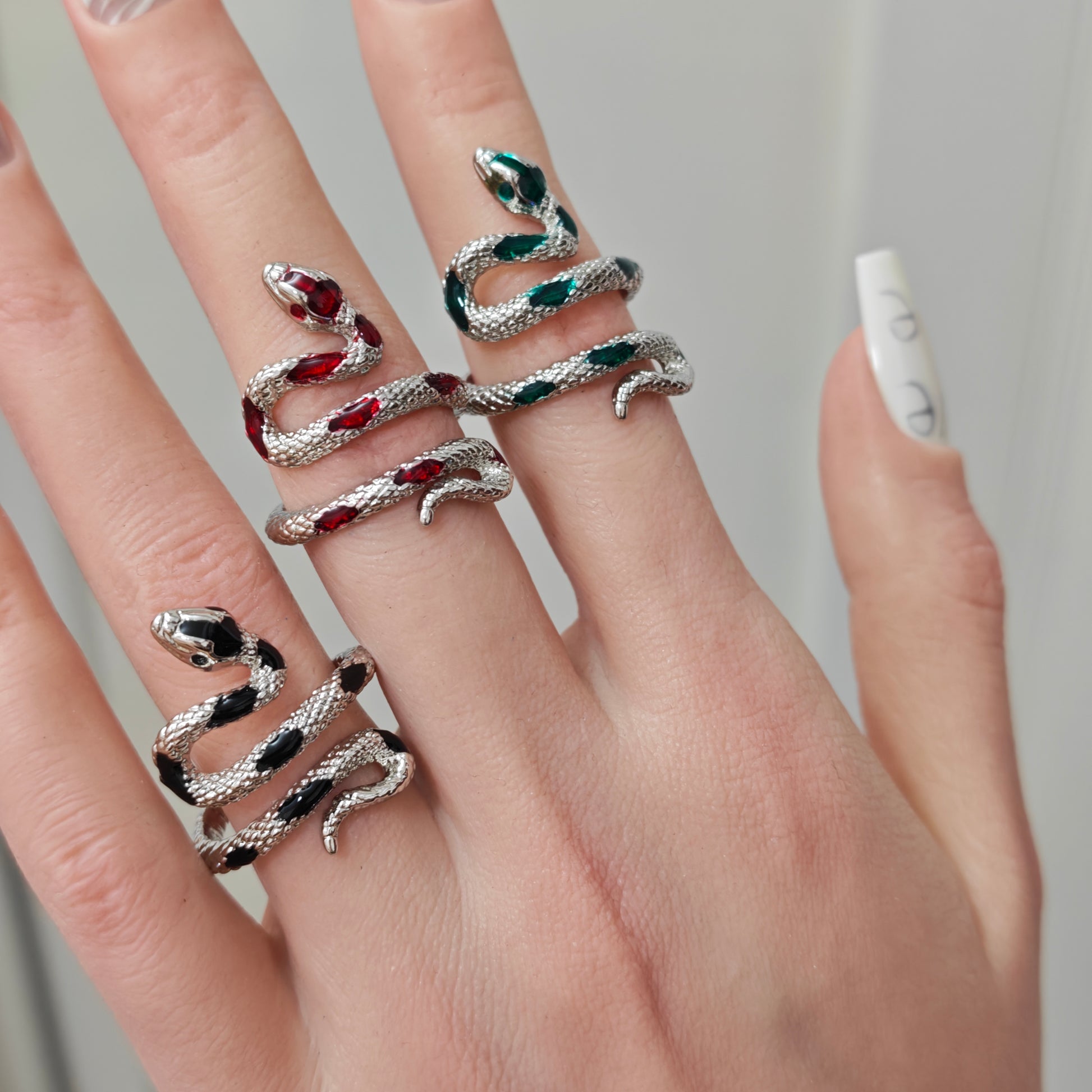 Coiled Snake Ring in open Aslop Jewelry white gift box, overhead flat view