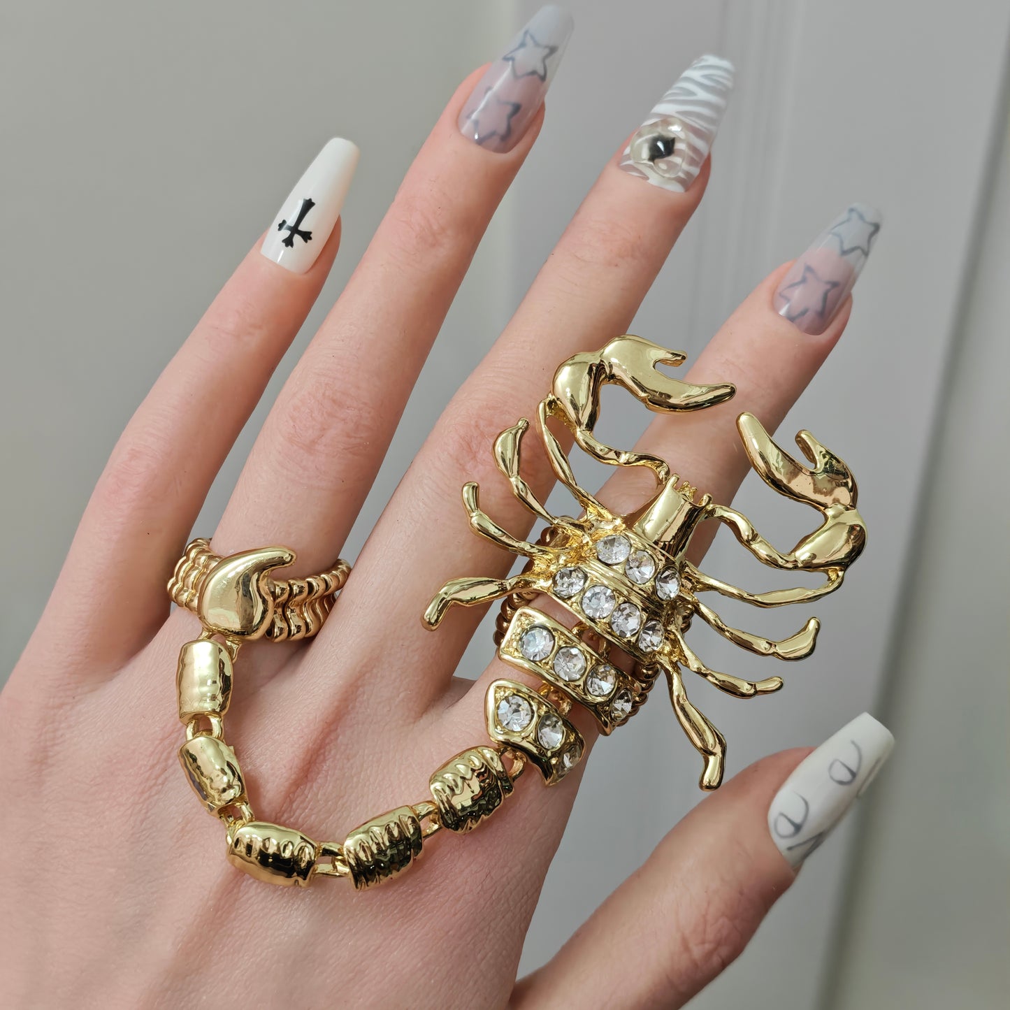 Scorpion Ring in open black velvet jewelry box, overhead flat lay