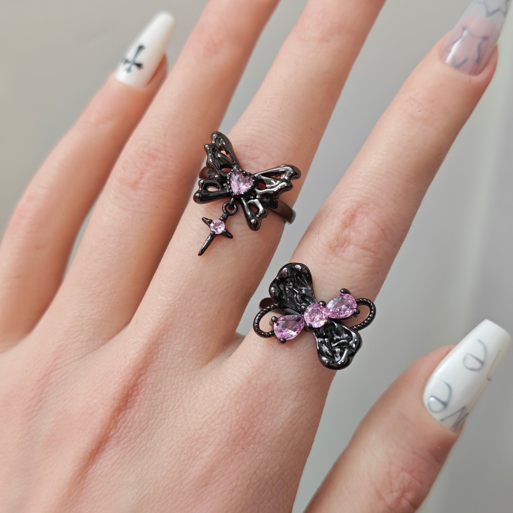 Pink Flutter Duo Adjustable Butterfly Heart & Crystal Stacking Rings side view detail, alternative dark aesthetic