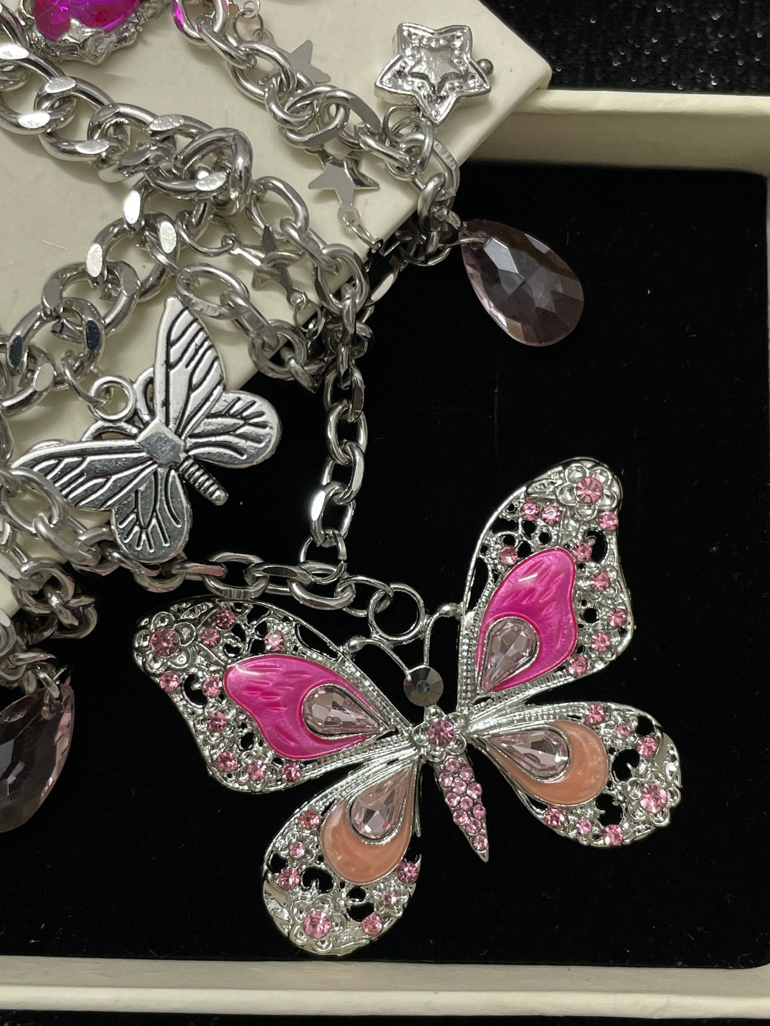 Pink Butterfly Charm Necklace close-up detail view showing silver red finish