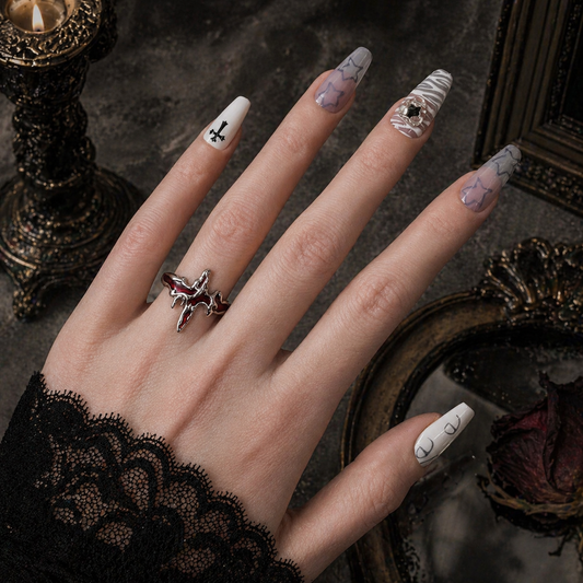 Flaming Cross Ring worn on finger, dark moody background – Aslop Treasure