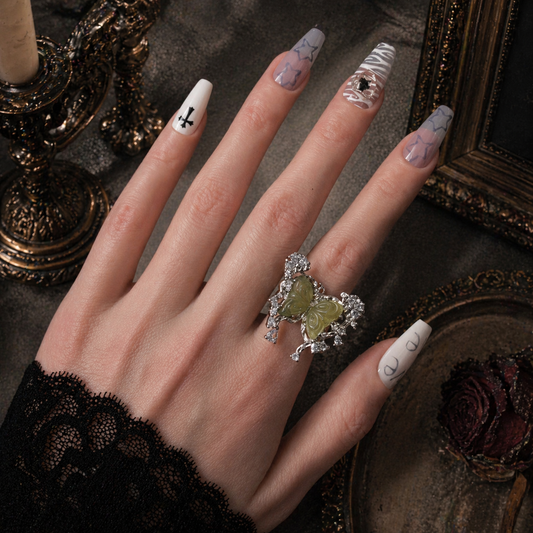 Green Carved Butterfly Ring worn on finger, dark moody background – Aslop Treasure
